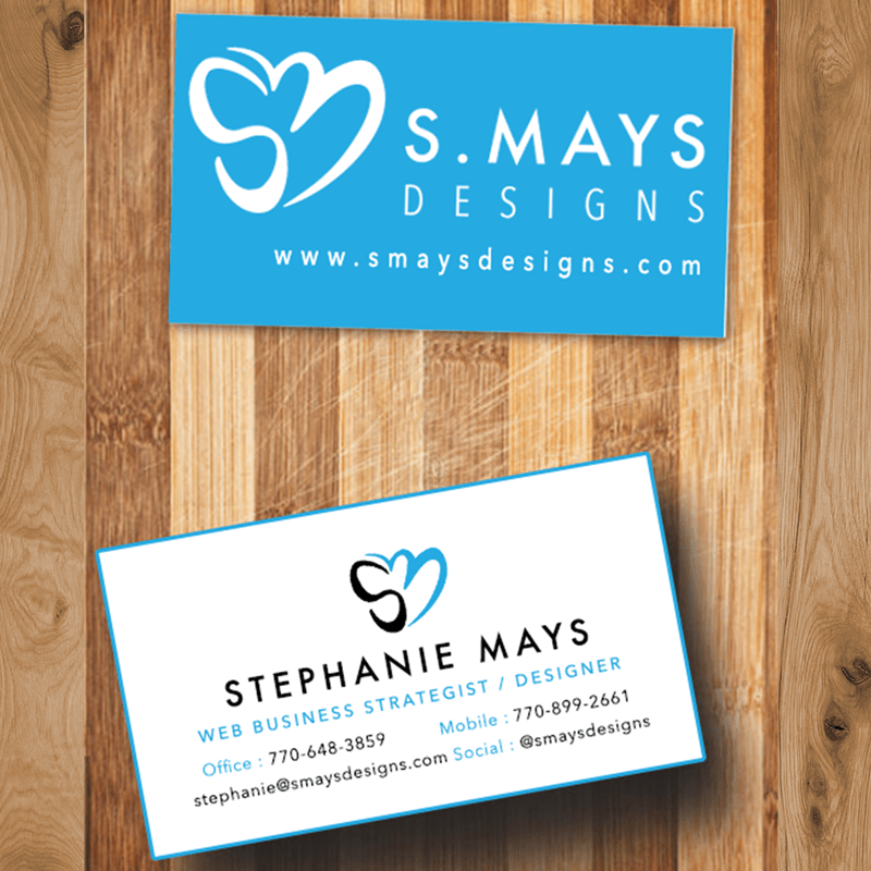 custom blue business card design on wood surface